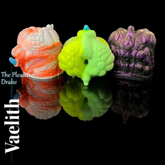 Vaelith Dragon Torso Masturbator in multiple custom colours, fantasy silicone dragon ass toy on black reflective background