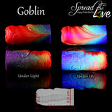 Goblin Volcano Pride silicone masturbator with UV-reactive rainbow finish