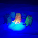 Small battery-powered black light torch for revealing glowing silicone effects