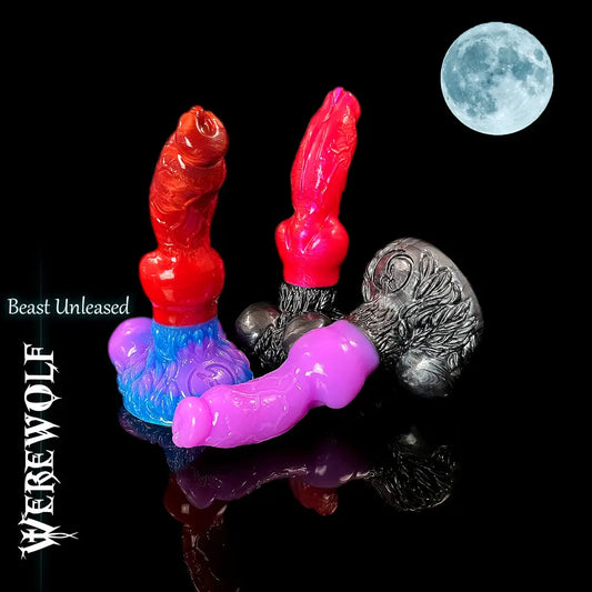 Three fantasy silicone werewolf dildo models in different colour combinations arranged together on a reflective black surface with a full moon in the top corner.