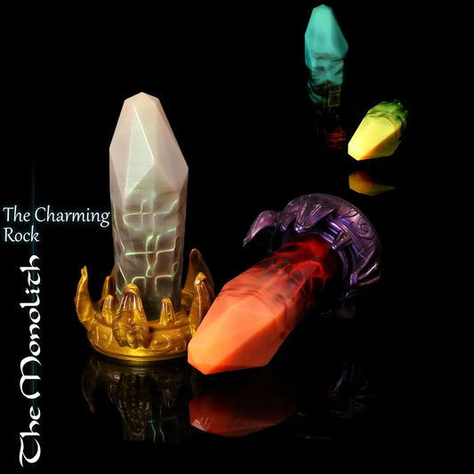Monolith crystal fantasy dildo by Love Smiths with alien crown base, glowing rune-like veins and faceted crystal shaft in multiple colour variations.