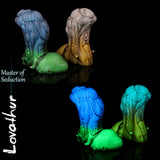 Lovathur fantasy alien dildo by Love Smiths shown in two colourways with biomechanical textures and sculpted base, Master of Seduction design.