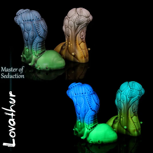 Lovathur fantasy alien dildo by Love Smiths shown in two colourways with biomechanical textures and sculpted base, Master of Seduction design.
