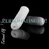 Personalised Tattooed Elf silicone masturbators in white and dark custom colours, showing the narrow entrance and engraved exterior