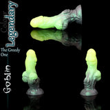 The "The Greedy One" Goblin pleasure product displayed in a Legendary color pour, showing a lime green head fading into a dark, metallic green base.