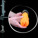Legendary Dwarf silicone masturbator in orange, blue and green fantasy colours held in two hands for scale