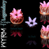 Fantasy Grinder Wyrm in Legendary colour, soft silicone grinder with pink tentacles, dragon scale texture and glow-in-the-dark effect