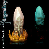 Monolith Legendary colour crystal fantasy dildo showing glow-in-the-dark effect compared with natural lighting.